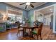 Bright dining room with octagonal table, offering views into the kitchen at 600 W Warren St, Shelby, NC 28150