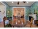Spacious dining area with hardwood floors and view of living room at 600 W Warren St, Shelby, NC 28150
