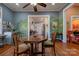 Open dining room with unique wall art and views into the kitchen and living areas at 600 W Warren St, Shelby, NC 28150