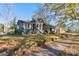 Gray craftsman home with a large yard and mature trees at 600 W Warren St, Shelby, NC 28150