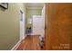 Bright hallway with hardwood floors and access to bedrooms and other rooms at 600 W Warren St, Shelby, NC 28150