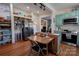 Rustic kitchen with teal cabinets, stainless steel appliances, and open shelving at 600 W Warren St, Shelby, NC 28150