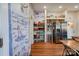 Kitchen features teal cabinets, stainless steel appliances, and a charming painted mural at 600 W Warren St, Shelby, NC 28150