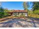 Green wooden workshop with covered storage area at 600 W Warren St, Shelby, NC 28150