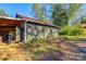 Rustic green workshop with adjacent covered storage at 600 W Warren St, Shelby, NC 28150