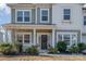 Front entrance with porch, landscaping, and wreath at 6721 Lennox St, Indian Land, SC 29707