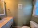 Clean bathroom with a single sink vanity and neutral wall colors at 7855 Nc Highway 90 E None, Stony Point, NC 28678