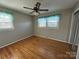 Well lit bedroom with hardwood floors and ceiling fan at 7855 Nc Highway 90 E None, Stony Point, NC 28678