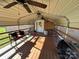 Covered patio with ceiling fan and seating area at 7855 Nc Highway 90 E E None, Stony Point, NC 28678