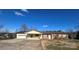 Brick ranch home features a covered carport and mature trees at 7855 Nc Highway 90 E None, Stony Point, NC 28678