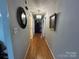 Bright hallway with hardwood floors and neutral walls at 7855 Nc Highway 90 E None, Stony Point, NC 28678