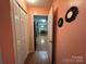 Hallway with built-in closet and view into the kitchen at 7855 Nc Highway 90 E E None, Stony Point, NC 28678