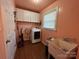 Laundry room with washer, dryer, and utility sink at 7855 Nc Highway 90 E None, Stony Point, NC 28678
