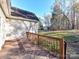 Wooden deck overlooking backyard with wooded area at 827 Hathcock Glen Dr, Oakboro, NC 28129