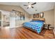 Main bedroom with hardwood floors, high ceilings and access to upper hall at 8904 Poplar Ridge Ct, Cornelius, NC 28031