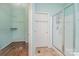 Bathroom with shower, walk-in closet and wood flooring at 9912 Mitchell Glen Dr, Charlotte, NC 28277