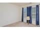 Bedroom with blue curtains and neutral carpet at 9912 Mitchell Glen Dr, Charlotte, NC 28277