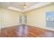 Living room showcasing hardwood floors and a ceiling fan at 9912 Mitchell Glen Dr, Charlotte, NC 28277