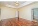 Spacious main bedroom with hardwood floors and ensuite access at 9912 Mitchell Glen Dr, Charlotte, NC 28277