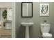 Convenient bathroom with pedestal sink and toilet at 1165 Blackburn Cir, Edgemoor, SC 29712