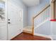 Bright entryway with white door, hardwood floors, and carpeted staircase at 1351 Hollythorn Dr, Rock Hill, SC 29732