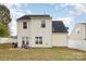 Backyard view with patio, grill, and white fence at 1351 Hollythorn Dr, Rock Hill, SC 29732