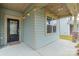 Charming front entrance with black door and sidelights, featuring a covered porch at 13524 Napoleon Dr, Charlotte, NC 28273