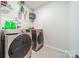 Convenient laundry room with washer, dryer, and shelving at 13524 Napoleon Dr, Charlotte, NC 28273