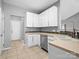 Modern kitchen with white cabinets and tile backsplash at 151 Samdusky Ln, Mooresville, NC 28117