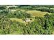 Aerial view of house on large lot with lush greenery at 1727 Will Schronce Rd, Lincolnton, NC 28092