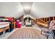 Unfinished attic space with storage and carpeted floor at 1727 Will Schronce Rd, Lincolnton, NC 28092