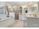 Luxurious bathroom with double vanity, soaking tub, and a large walk-in shower at 1727 Will Schronce Rd, Lincolnton, NC 28092