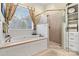 Spa-like bathroom with soaking tub, walk-in shower, and updated fixtures at 1727 Will Schronce Rd, Lincolnton, NC 28092