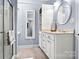 Bathroom with white vanity, blue walls, and brick floor at 1727 Will Schronce Rd, Lincolnton, NC 28092