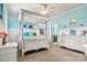 Bright bedroom with white canopy bed, dresser, and light blue walls at 1727 Will Schronce Rd, Lincolnton, NC 28092