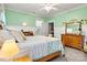 Bedroom with wooden bed frame, dresser, and light green walls at 1727 Will Schronce Rd, Lincolnton, NC 28092