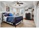 Bedroom with metal bed frame, dresser, and gray walls at 1727 Will Schronce Rd, Lincolnton, NC 28092