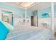 Spacious bedroom with striped bedding and built-in shelving at 1727 Will Schronce Rd, Lincolnton, NC 28092