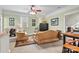 Spacious bonus room with two sofas, a game table, and plenty of natural light at 1727 Will Schronce Rd, Lincolnton, NC 28092