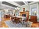 Farmhouse-style dining room with a wooden table and fireplace at 1727 Will Schronce Rd, Lincolnton, NC 28092