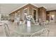 Relaxing front porch with rocking chairs and a glass-top table, perfect for enjoying the outdoors at 1727 Will Schronce Rd, Lincolnton, NC 28092