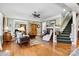 Spacious living room featuring hardwood floors, fireplace, and ample natural light at 1727 Will Schronce Rd, Lincolnton, NC 28092