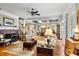 Open concept living room with hardwood floors, a fireplace, and views of dining area at 1727 Will Schronce Rd, Lincolnton, NC 28092