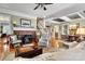 Living room with hardwood floors, fireplace, and views into the kitchen and dining areas at 1727 Will Schronce Rd, Lincolnton, NC 28092