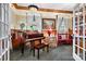 Elegant music room featuring a grand piano, wood accents, and ample natural light at 1727 Will Schronce Rd, Lincolnton, NC 28092