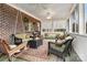 Relaxing screened porch with wicker furniture and ceiling fan at 1727 Will Schronce Rd, Lincolnton, NC 28092