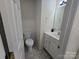 Small bathroom with toilet, sink, and vanity at 179 Delwood Ct, Mount Gilead, NC 27306