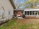 Brick patio with a screened-in porch, seating area, and grill at 192 25Th Nw St, Hickory, NC 28601