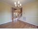 Bright dining area with hardwood floors and access to living room at 2000 Shadwell Ct, Gastonia, NC 28056