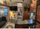 RV kitchen features a double sink, microwave, and ample cabinetry at 204 Lake Tillery Trl, Mount Gilead, NC 27306